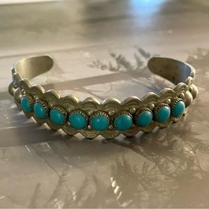 Cuff Bracelet with turquoise look stones set on silver metal.Adjustable One Size